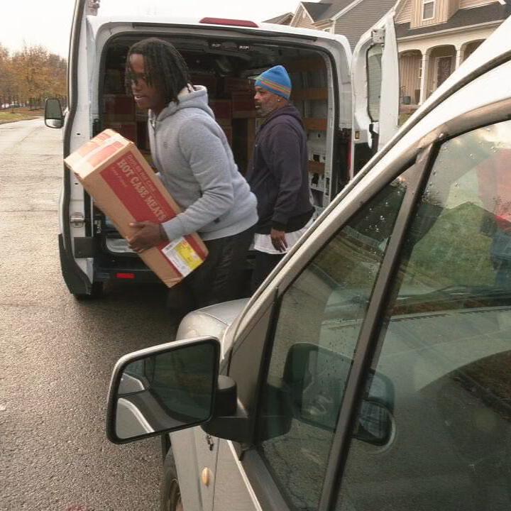 Louisville's Community Connections Group delivers frozen turkeys and chicken to community members ahead of the Thanksgiving holiday